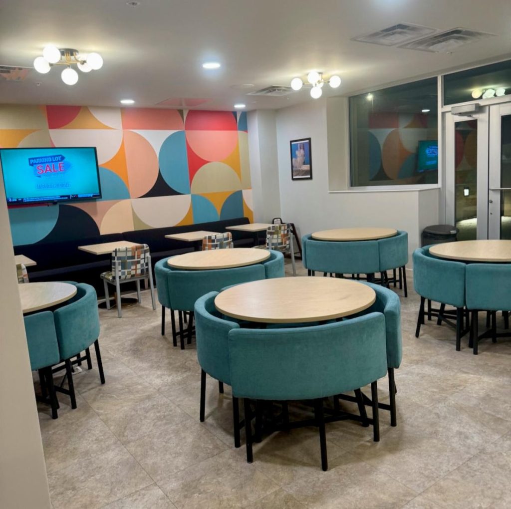 dining hall with bright blue tables