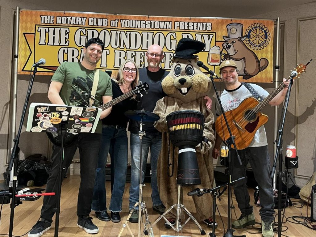 Groundhog mascot with the band at the Youngstown Rotary Groundhog Beerfest