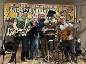 Groundhog mascot with the band at the Youngstown Rotary Groundhog Beerfest