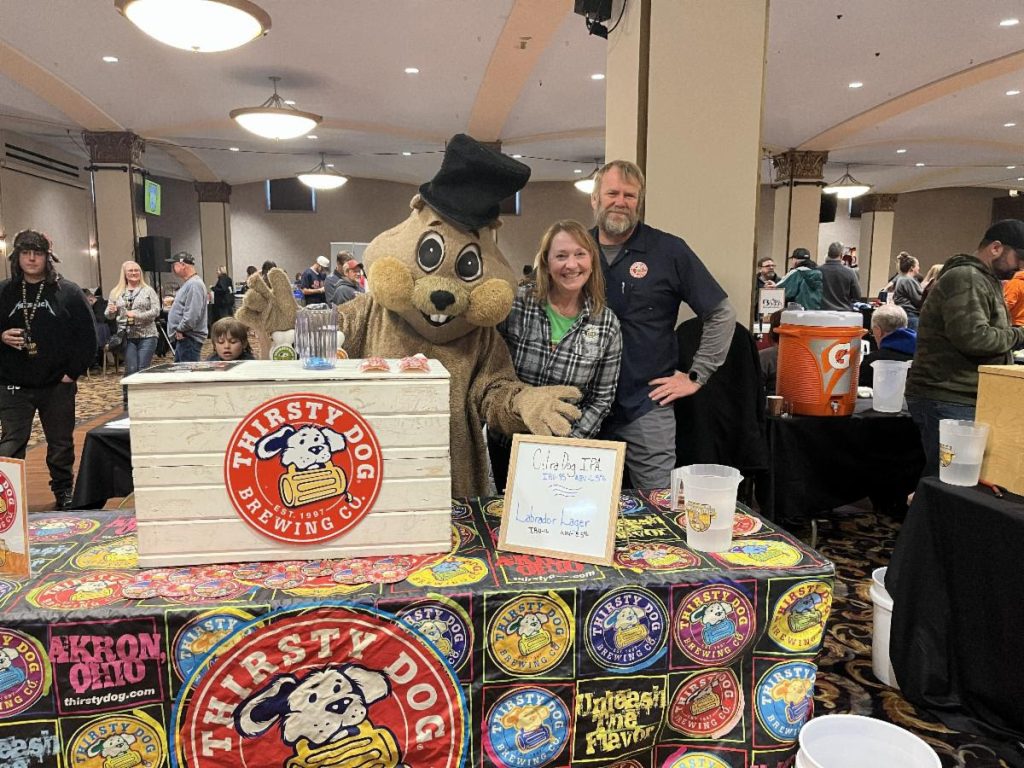 Groundhog mascot at a table at the Youngstown Rotary Groundhog Beerfest