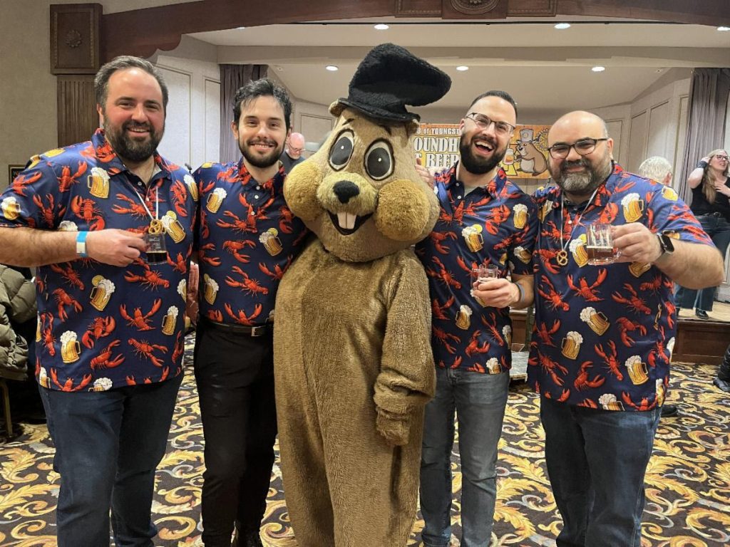 Groundhog mascot at the Youngstown Rotary Craft Beerfest with four men
